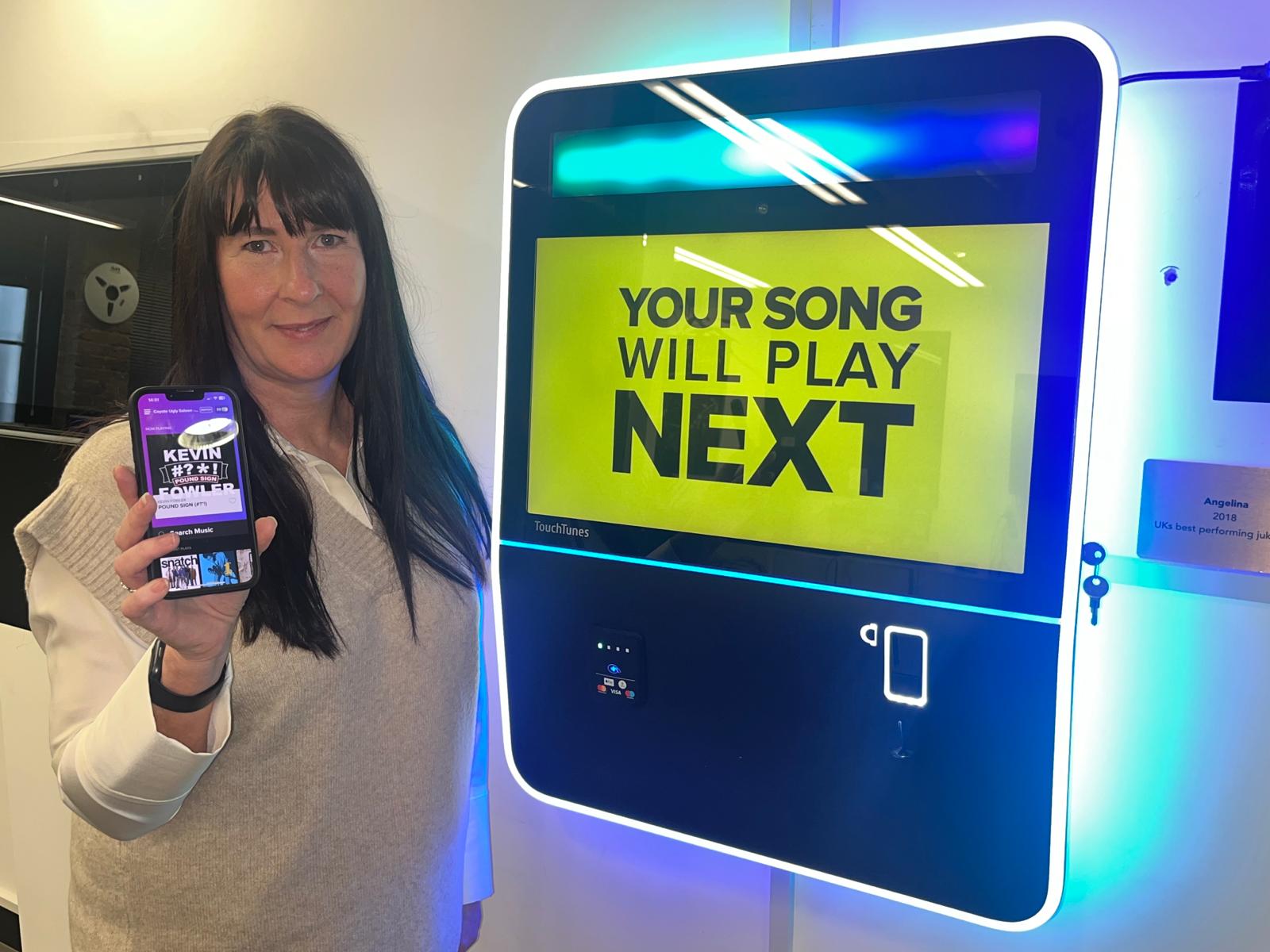 TouchTunes' Karen Sarosi with the app